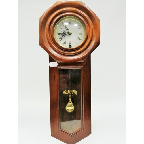 190 - Minature mechanical 30 day Regulator which measures 18 inches long. Running order in excellent condi... 