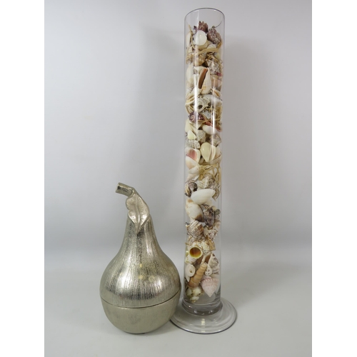 373 - White metal pear storage jar plus a tall glass vase full of sea shells, 58cm tall.