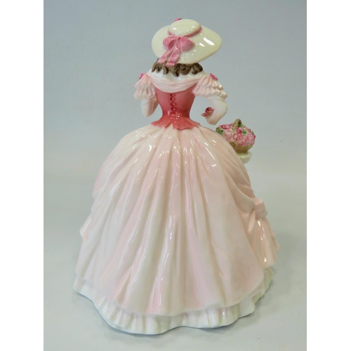 296 - Large Coalport figurine which measures approx 9 inches tall. See photos.