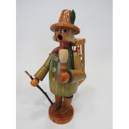 589 - Three German made wooden novelty toys,  Smoking shoe seller, Smoking flute model plus one other figu... 