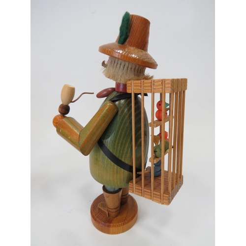 589 - Three German made wooden novelty toys,  Smoking shoe seller, Smoking flute model plus one other figu... 