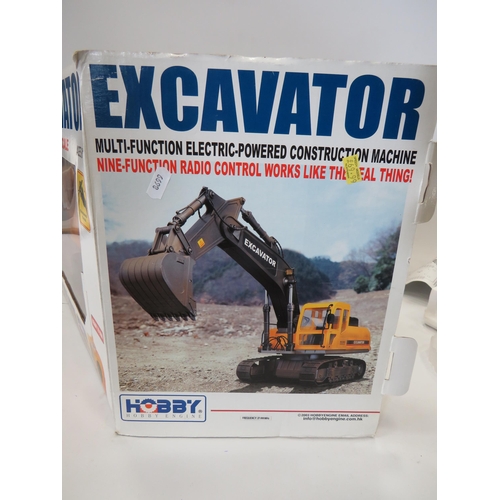 592 - Hobby Excavator in 1:12 Scale with re-chargable battery and remote control. Believed to be complete ... 