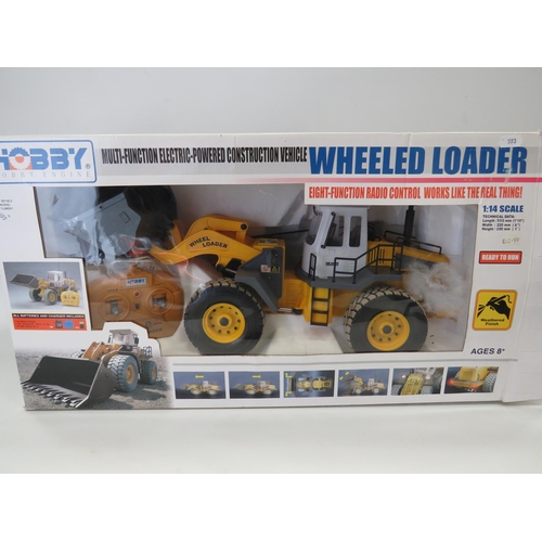 593 - Hobby Wheeled Loader in 1:14 Scale with re-chargable battery and remote control. Believed to be comp... 