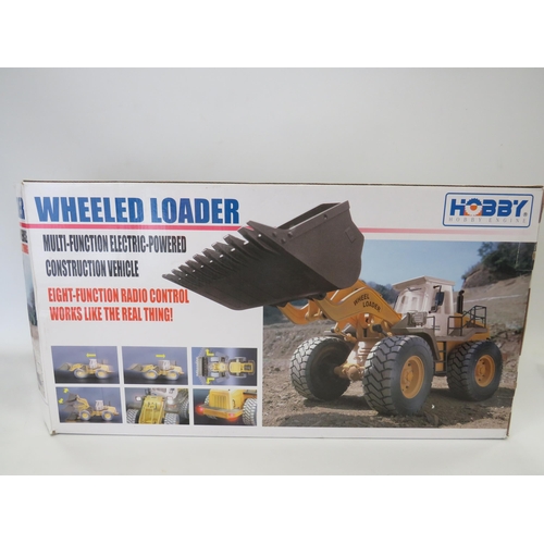 593 - Hobby Wheeled Loader in 1:14 Scale with re-chargable battery and remote control. Believed to be comp... 