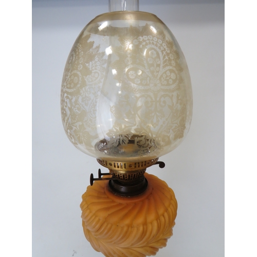 660 - Brass and Glass Oil lamp with Corinthian style Column base and milk glass reservoir .  Clear glass c... 