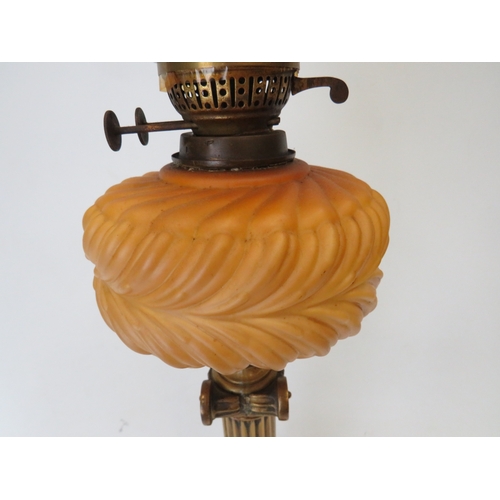 660 - Brass and Glass Oil lamp with Corinthian style Column base and milk glass reservoir .  Clear glass c... 