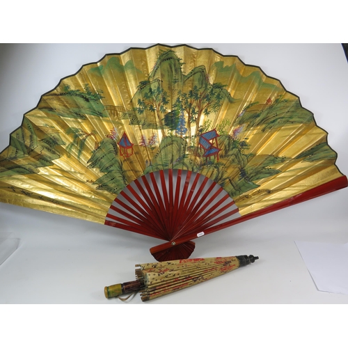 488 - Large chinese handpainted fan approx 75cm long plus a vintage parasol.