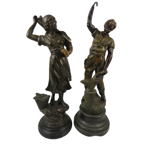 664 - Pair of Spelter Figurines which measure approx 20 inches tall. (slight damage to the left hand of th... 