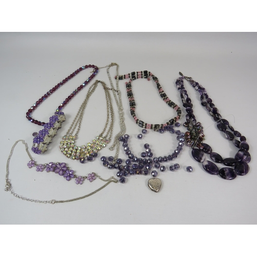 714 - Costume jewellery including a sterling silver locket and a semi precious stone and pearl necklace et... 