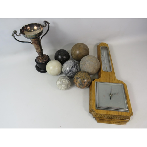 1072 - Mixed lot to include a barometer and thermometer, Silver plated trophy and 7 polished stone balls.