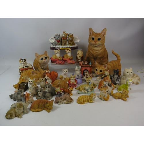 1091 - Large selection of resin cat figurines.