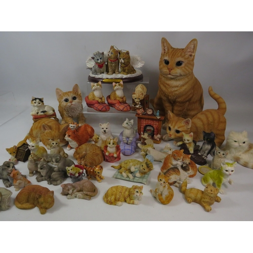 1091 - Large selection of resin cat figurines.