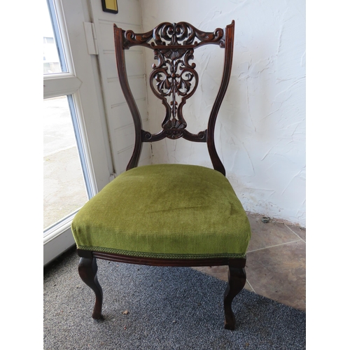 1156 - Antique Mahogany low palour chair with craved back rest.