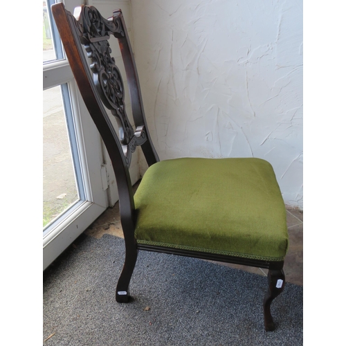 1156 - Antique Mahogany low palour chair with craved back rest.