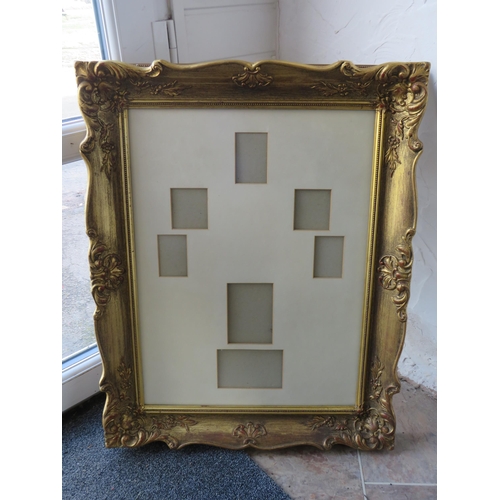 Large ornate gilt picture frame, 29 inch by 23.5 inches.