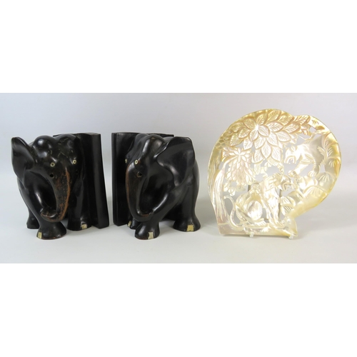 1350 - A pair Lignum Vitae Elephant bookends plus a carved mother of pearl shell.