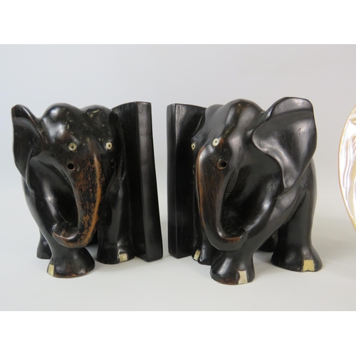 1350 - A pair Lignum Vitae Elephant bookends plus a carved mother of pearl shell.