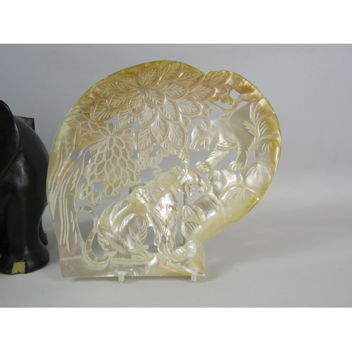 1350 - A pair Lignum Vitae Elephant bookends plus a carved mother of pearl shell.