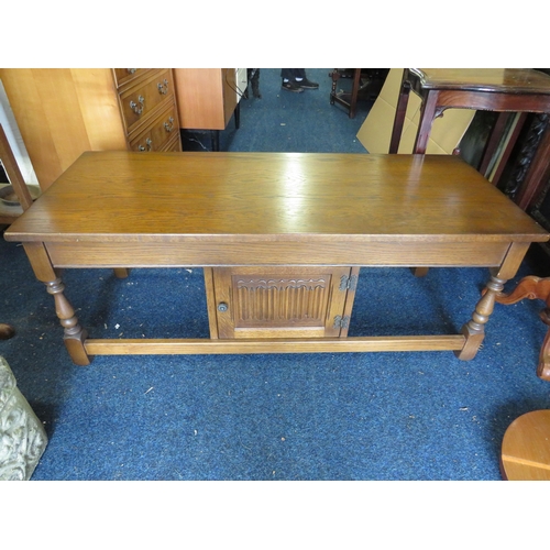 1342 - Old Charm low table with handy central cupboard with linen press decoration to cupboard door.  In Ex... 