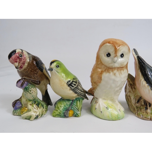 10 - 4 Beswick bird figurines, slight chip to the beak on Nuthatch.