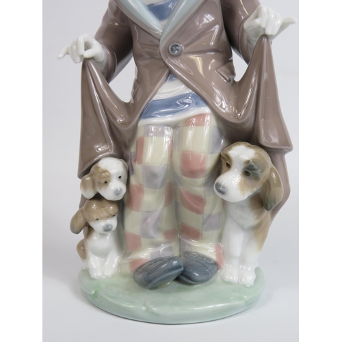 18 - Lladro figurine of a clown with dogs hiding under his coat, model no 5901, approx 25cm tall. With bo... 