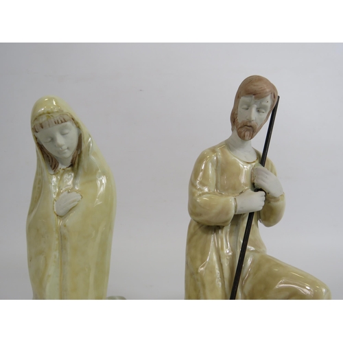 37 - 3 Ceramic figurines depiciting Joseph, Mary and Baby Jesus, the tallest stands 19.5cm.