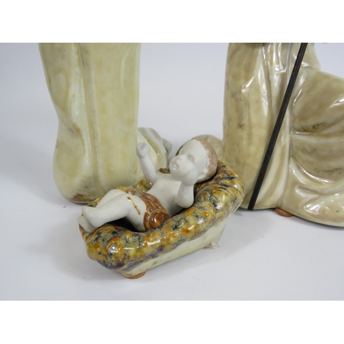 37 - 3 Ceramic figurines depiciting Joseph, Mary and Baby Jesus, the tallest stands 19.5cm.