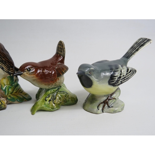 4 - 4 Beswick bird figurines, slight chip to underside of beak on wagtail.