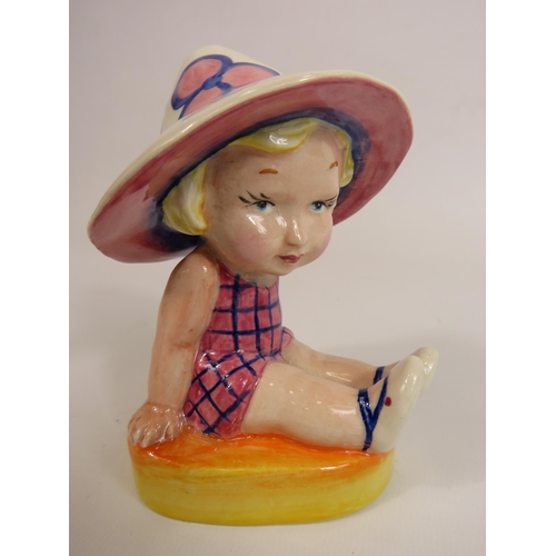 56 - Lorna Bailey Art deco style figurine No 1 of 1, little girl seated wearing a sun hat. 13cm tall.