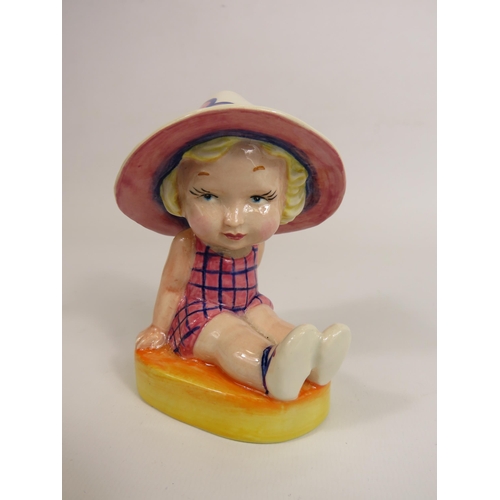 56 - Lorna Bailey Art deco style figurine No 1 of 1, little girl seated wearing a sun hat. 13cm tall.