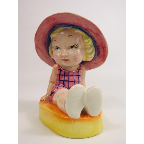 56 - Lorna Bailey Art deco style figurine No 1 of 1, little girl seated wearing a sun hat. 13cm tall.