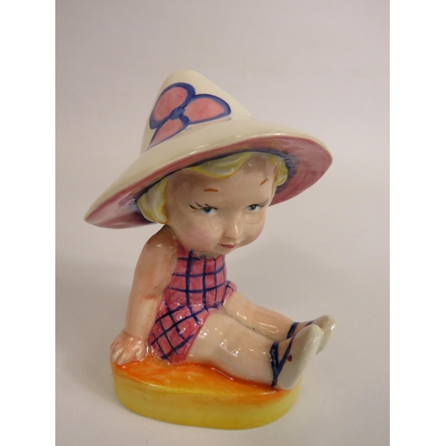 56 - Lorna Bailey Art deco style figurine No 1 of 1, little girl seated wearing a sun hat. 13cm tall.