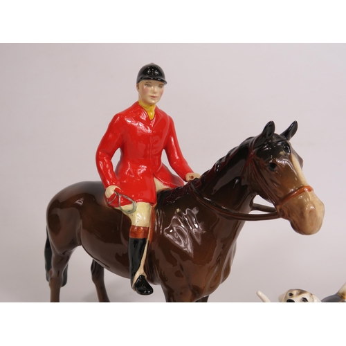 59 - Beswick Huntsman on a bay horse, 3 Hounds and a fox. (one hound has a repair to the tail)