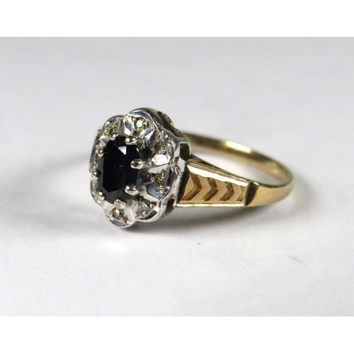 299 - 9ct Yellow Gold Ring set with a Central Sapphire with small diamond set surround .  Finger size 'N-5... 