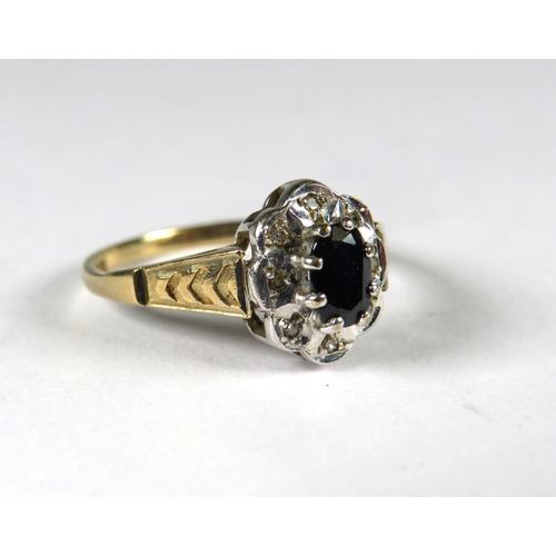 299 - 9ct Yellow Gold Ring set with a Central Sapphire with small diamond set surround .  Finger size 'N-5... 