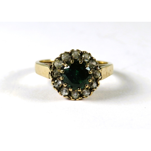 304 - 9ct Yellow Gold Gemstone set ring in flower patter.   Finger size M-5    2.7g