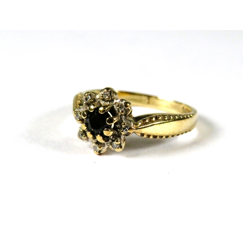 305 - 9ct Yellow Gold ring set with a small Circular Central Sapphire with Diamond surround in a flower pa... 