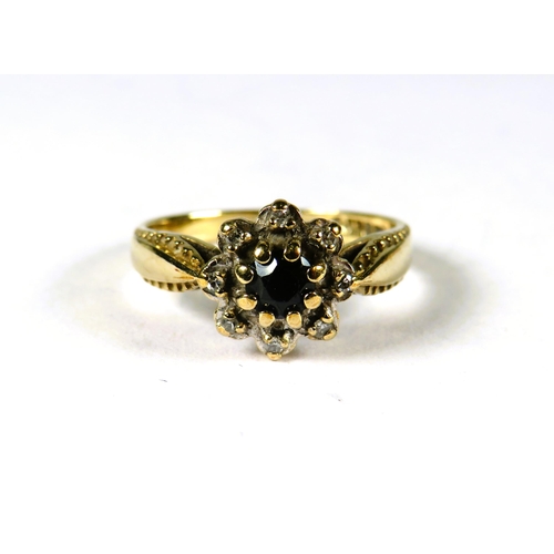 305 - 9ct Yellow Gold ring set with a small Circular Central Sapphire with Diamond surround in a flower pa... 