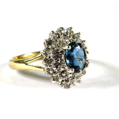 311 - Very Pretty 9ct Yellow Gold ring set with a Central Oval shaped Sapphire and Tiny Diamonds surroundi... 