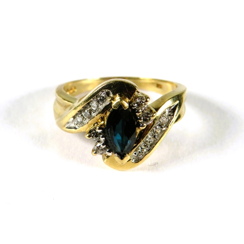 312 - 9ct Yellow Gold ring set with an Oval Central Sapphire, Multiple Diamond surround in a wave pattern.... 