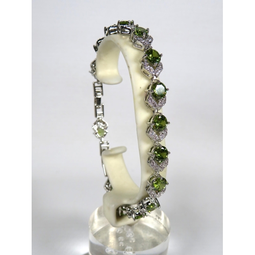 322 - 925 Silver Bracelet, 8 inches with detachable extension. Set with Synthetic Peridot & White Topaz as... 