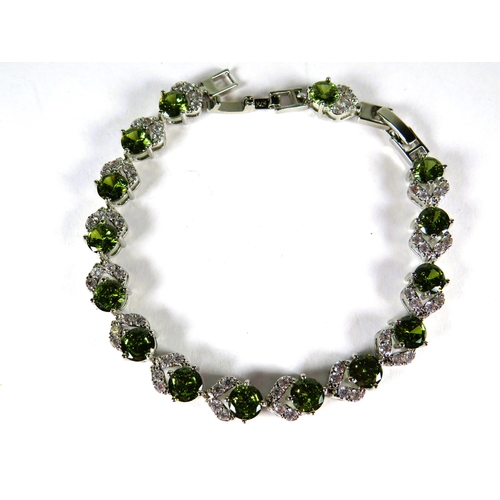 322 - 925 Silver Bracelet, 8 inches with detachable extension. Set with Synthetic Peridot & White Topaz as... 