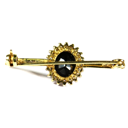 337 - Unusual and high quality 9ct Yellow Gold Sapphire set bar brooch. Central Sapphire with Diamond surr... 