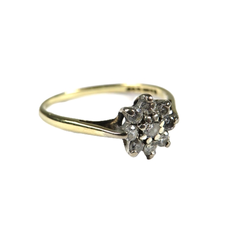 344 - 9ct Yellow Gold Diamond set ring in a flower pattern.   Finger size 'O'   1.4g