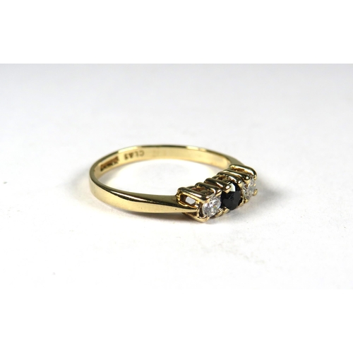 347 - 9ct Yellow Gold ring set with a small Central Sapphire Flanked by CZ.  Finger size 'K'    1.3g