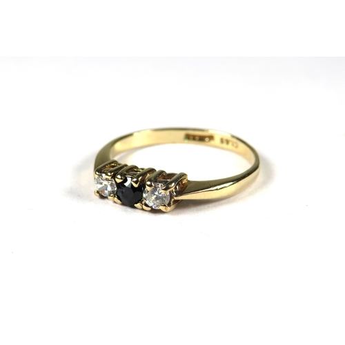 347 - 9ct Yellow Gold ring set with a small Central Sapphire Flanked by CZ.  Finger size 'K'    1.3g