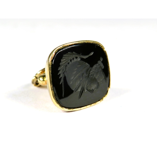 374 - 9ct Yellow Gold fob set with a black onyx stone carved with a Centurions Head.  Hallmarked for Londo... 