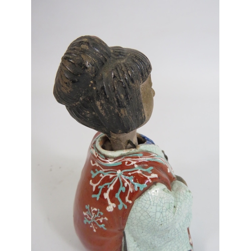 105 - Antique oriental ceramic nodding head figure, 13.5cm tall.