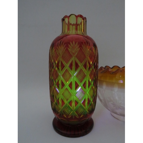 115 - Ruby cut to amber Bohemian uranium glass vase, slight chips to the rim. The vase stands 24cm tall. p... 