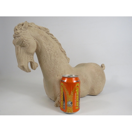 66 - Large Tang stone horse sculpture, approx 30cm tall and 48cm long.